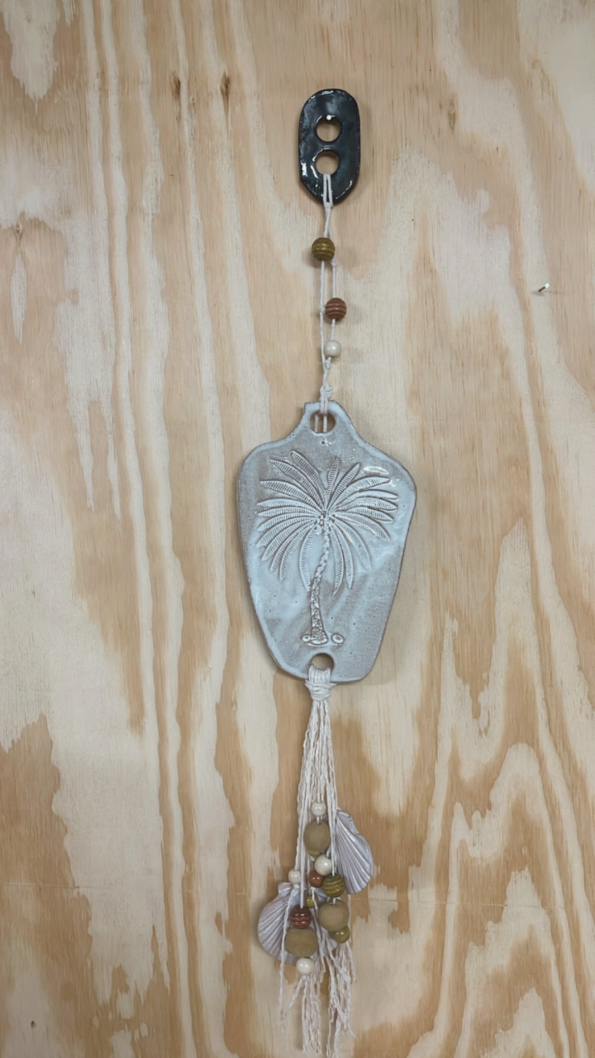 Ceramic palm wall hanging